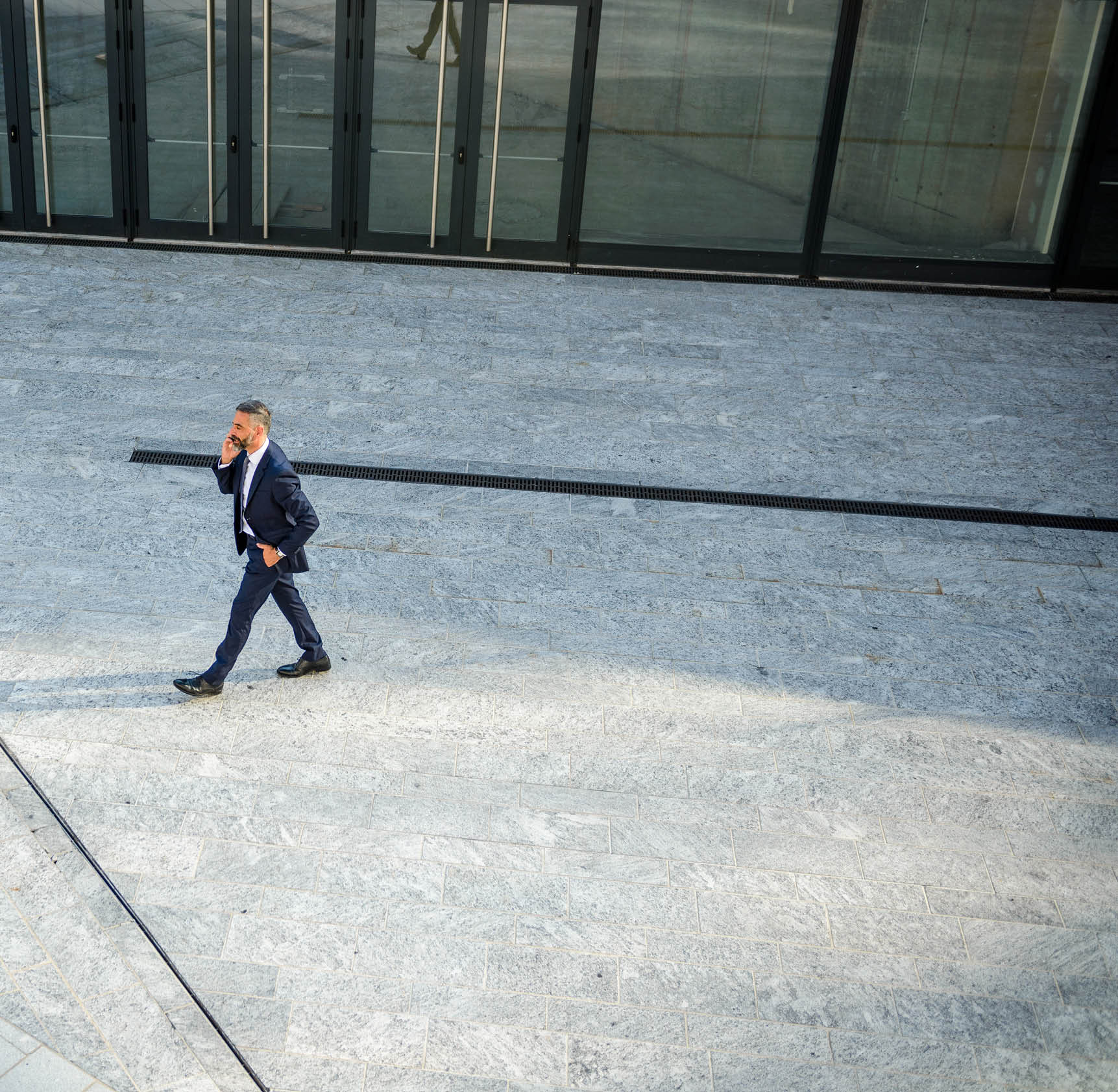 Overview of a businessman talking on the mobile phone