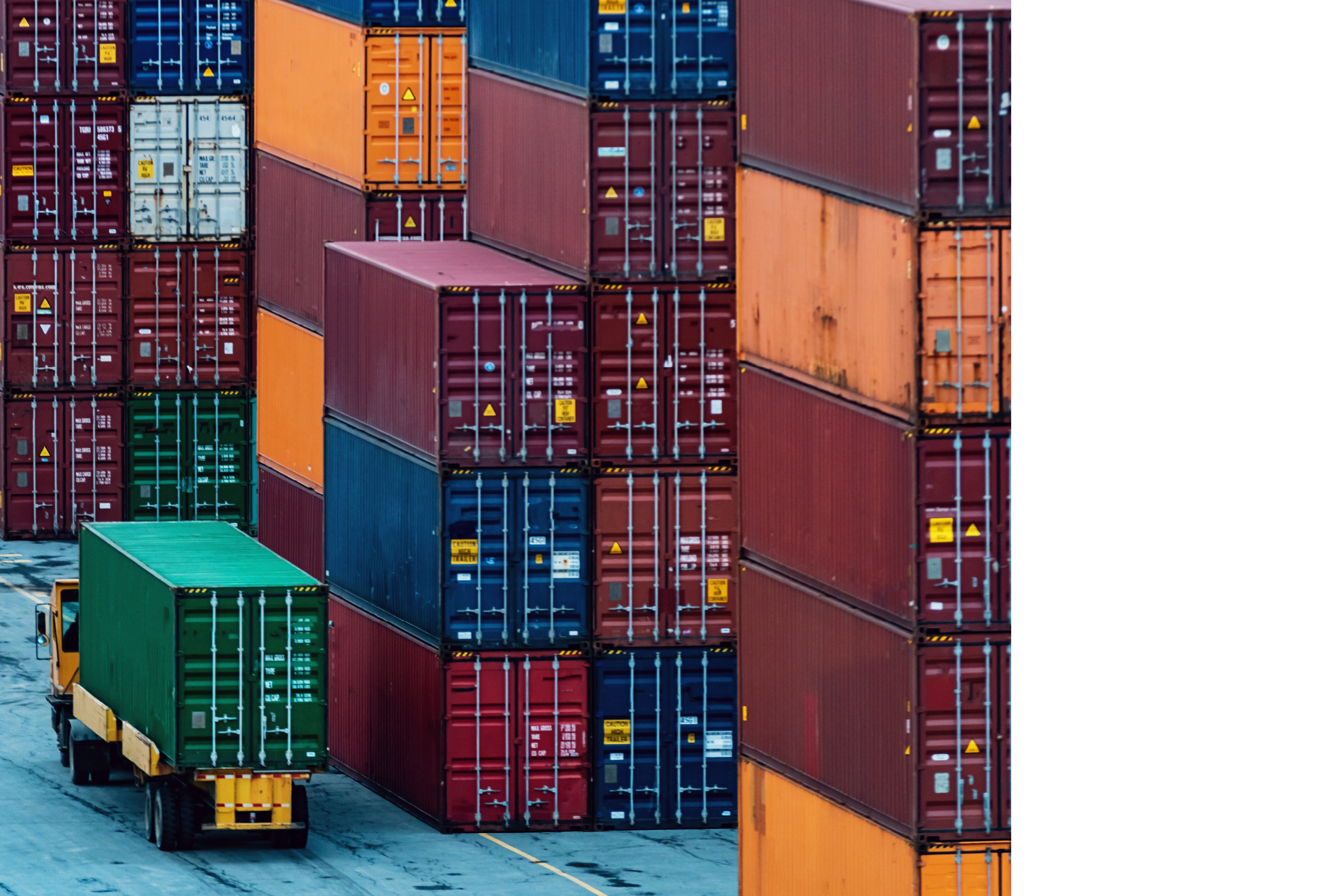 Shipping containers stacked high at a container pier.